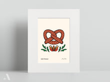 Load image into Gallery viewer, Illustrated Soft Pretzel small print, matted to 8x10”, showcasing this beloved Pennsylvania Dutch snack, golden and twisted to perfection. A perfect addition to your kitchen or rustic dining space.